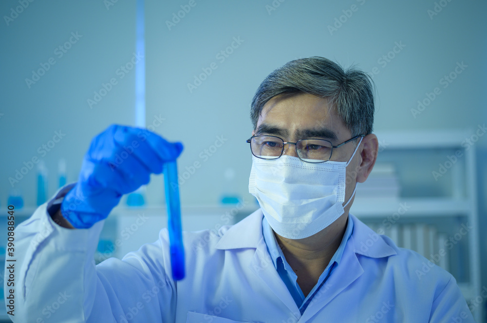 Scientist holding liquid chemical tube in laboratory, Science and technology healthcare concept Scientist holding liquid chemical tube in laboratory, Science and technology healthcare concept