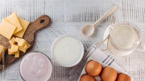 Banner flatlay a variety of dairy products, cheese, farm eggs. The concept of the farmer's market. Copy space.