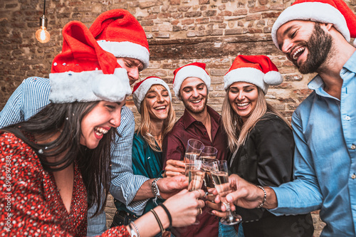 Photography Merry Christmas and Happy New Year! - Multiracial young smiling friends are cele
