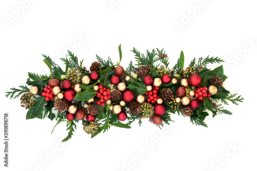 Christmas holly with red & gold bauble decorations & traditional winter greenery on white background. Festive composition for the holiday season. Flat lay, top view, copy space. 