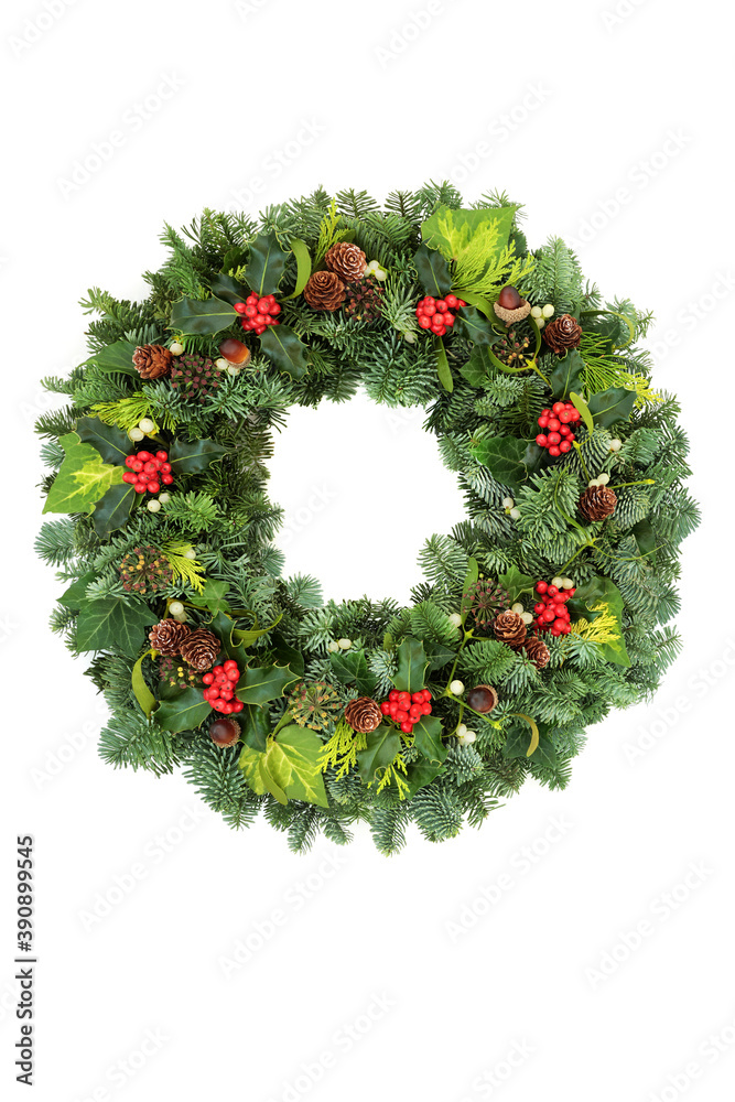 Christmas traditional spruce fir wreath with winter berry holly, ivy, mistletoe, pine cones & acorns on white background. Natural greenery composition for the festive season & New Year. Copy space. Christmas traditional spruce fir wreath with winter berry holly, ivy, mistletoe, pine cones & acorns on white background. Natural greenery composition for the festive season & New Year. Copy space.