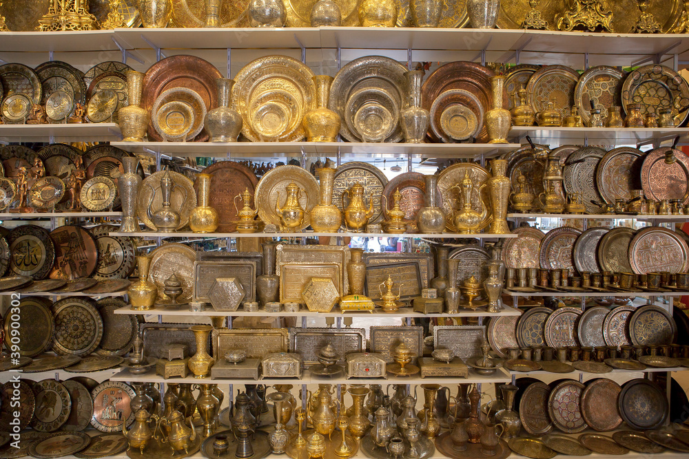 Egyptian traditionally bronze souvenirs on the shelf in the store.