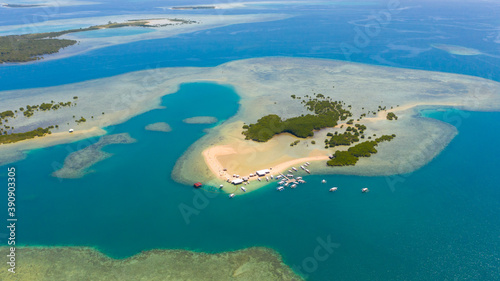 Starfish Island, Puerto Princesa, Palawan.Lots of boats on the beach, tourist route. Island hopping Tour at Honda Bay, Palawan.