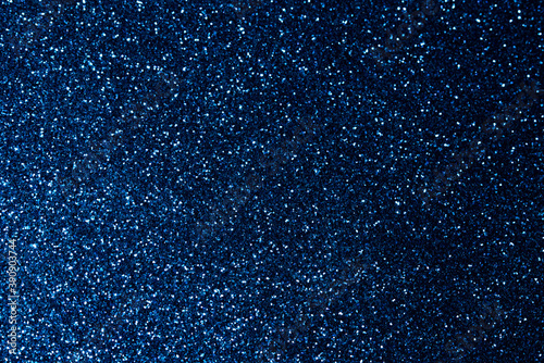 Abstract bokeh dark blue with light background.Navy blue color night light elegance,smooth backdrop,artwork design for new year,Christmas sparkling glittering or special day.Selective focus image.