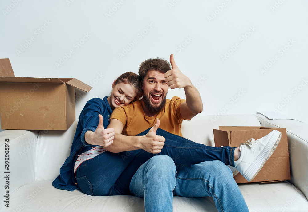 young couple in the room housewarming boxes with things moving emotions fun young couple in the room housewarming boxes with things moving emotions fun