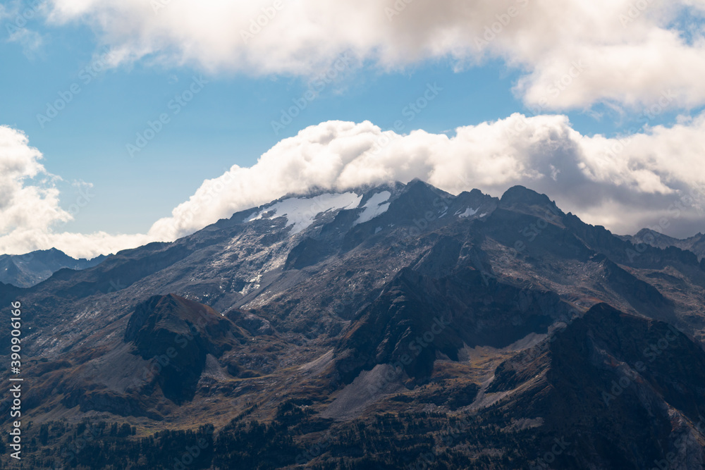 Views of the Maladetas massif with the Aneto and Maladeta peaks and Aneto glacier with some cloud from the Sacroux peak in the Aragonese Pyrenees Views of the Maladetas massif with the Aneto and Maladeta peaks and Aneto glacier with some cloud from the Sacroux peak in the Aragonese Pyrenees