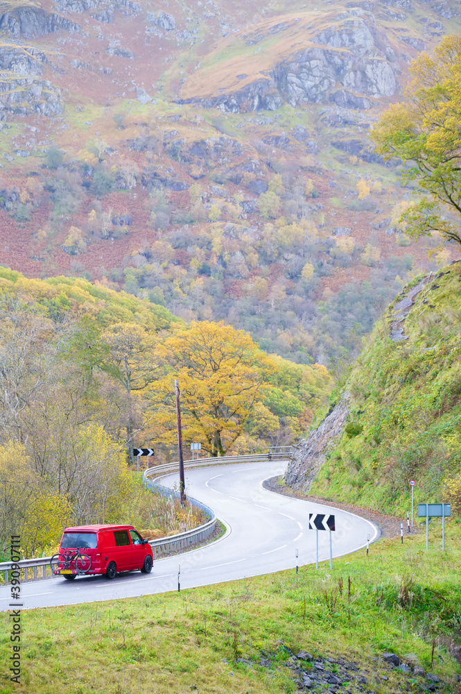 Camper van on dangerous bend in rural countryside Camper van on dangerous bend in rural countryside