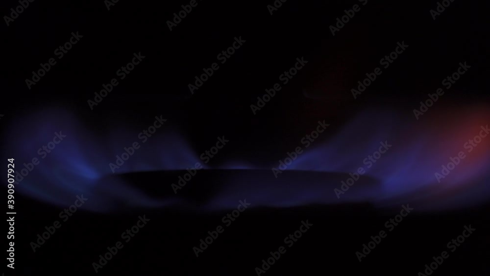 Macro Shot Of Kitchen Cooker Oven Gas Stove Burner Glowing Blue With Flames Macro Shot Of Kitchen Cooker Oven Gas Stove Burner Glowing Blue With Flames