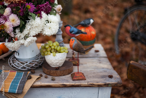 autumn background.vintage table with pumpkins and oranges in the autumn garden.