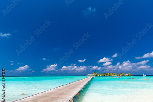 Fototapeta Naklejka Na Ścianę i Meble -  Jetty over atoll and a tropical resort island in Maldives