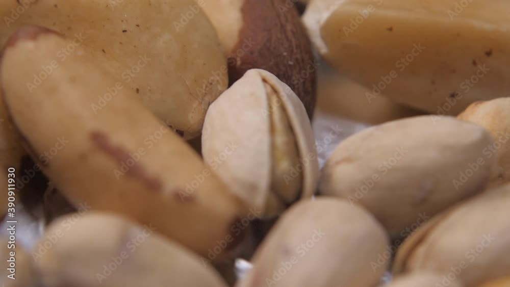 Pistachios close up. Brazil nut close-up. Exotic nuts are on the table and dried. Lots of nuts on a white surface. Diet food. Vegan food. Protein diet.