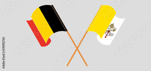 Crossed and waving flags of Belgium and Vatican