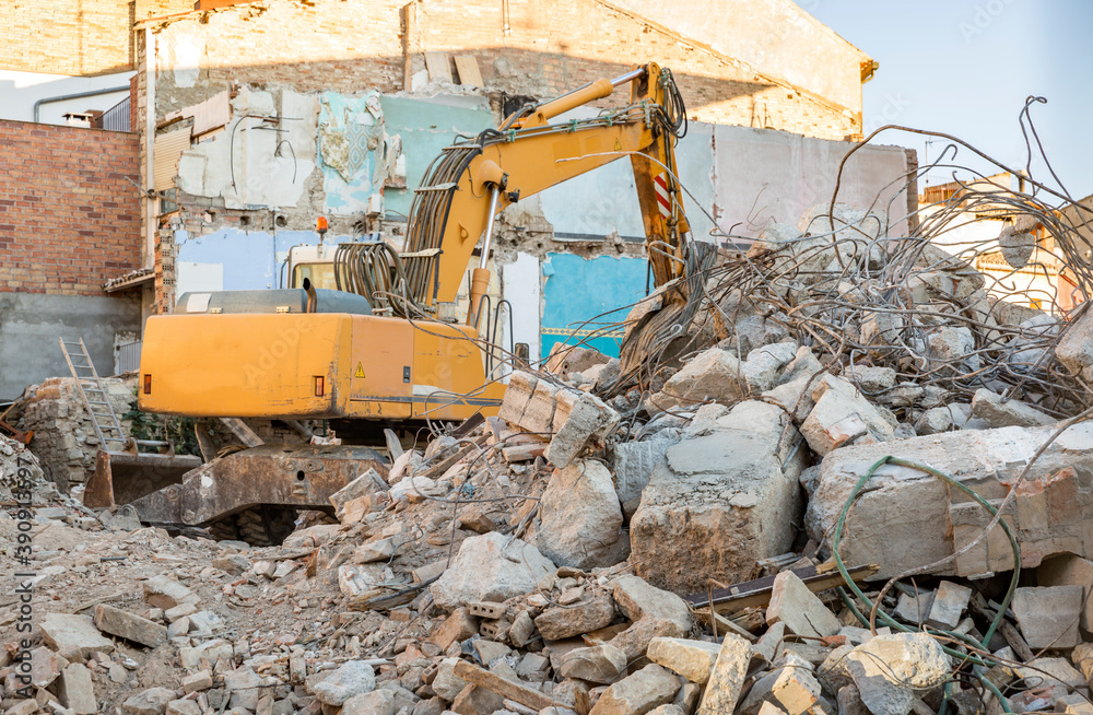 demolition of an old building with a bulldozer on site demolition of an old building with a bulldozer on site