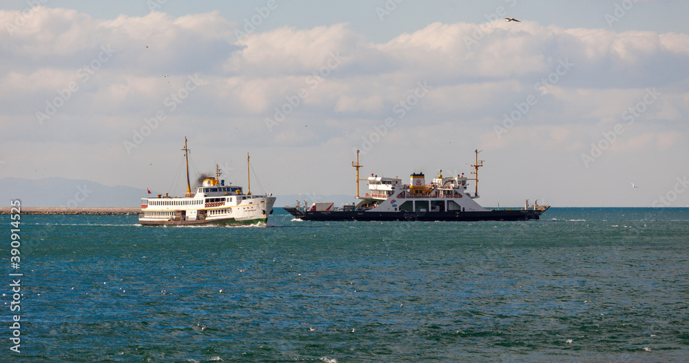 The traditional ships of Istanbul are sailing towards each other. Ferry and car carrying ferry are sailing in Istanbul strait. The traditional ships of Istanbul are sailing towards each other. Ferry and car carrying ferry are sailing in Istanbul strait.