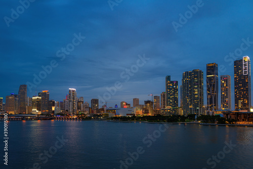 Beautiful colorful city of Miami Florida skyline and bay with night clouds. Miami skyline on Biscayne Bay, city night backgrounds.