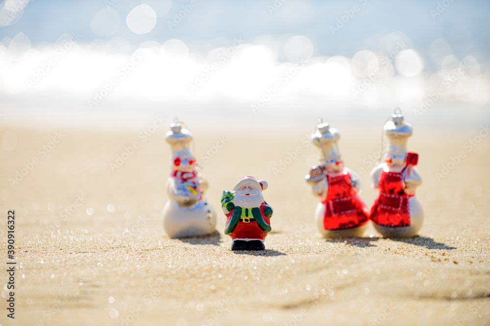 Summer Santa Claus with smowmen. Family holiday. Christmas and new year vacation concept on tropical beach.