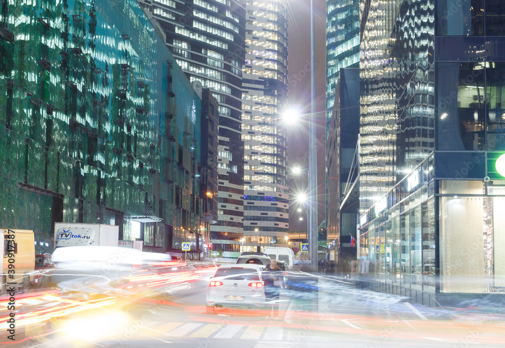 Obraz premium Moscow, Russia, Nov 4, 2020: Office buildings in Moscow International Business Center (Moscow-city). Evening. Street. Long exposure