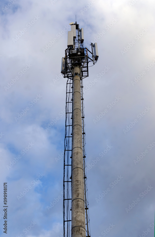 cell tower against a blue sky with clouds cell tower against a blue sky with clouds