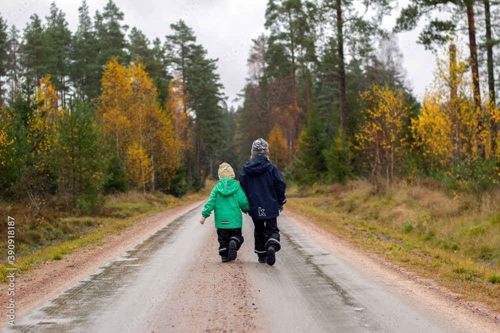 Two childs walking hand in hand Two childs walking hand in hand