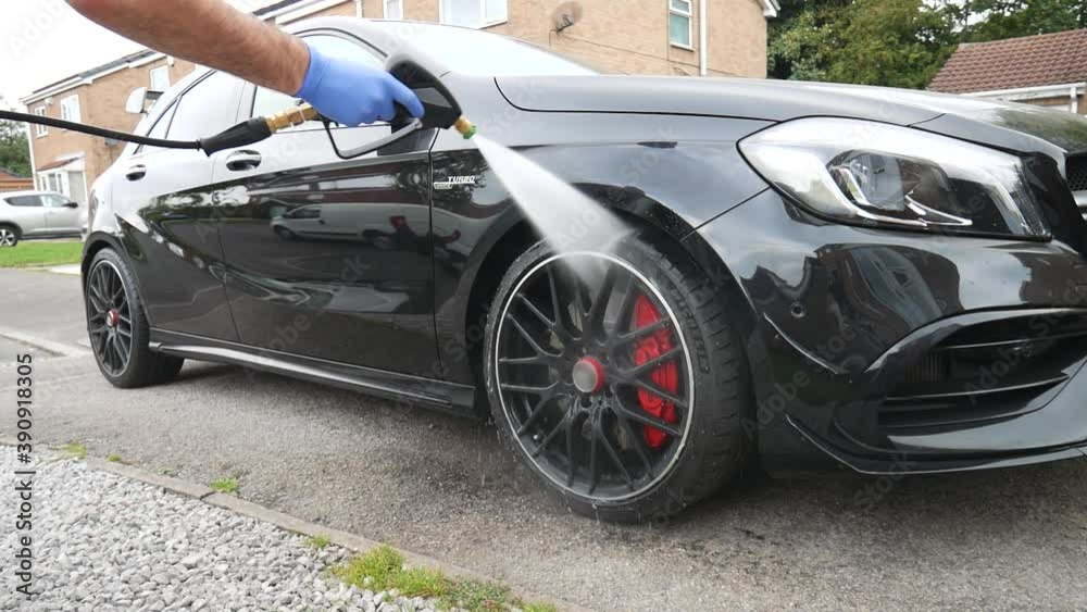 Rinsing black alloy wheels with pressure washer Rinsing black alloy wheels with pressure washer
