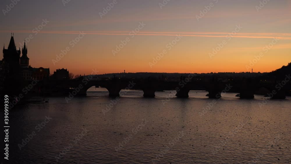 silhouette of Charles Bridge and flowing Vltava river in the center of Prague at sunset The sky is colored by light
silhouette of Charles Bridge and flowing Vltava river in the center of Prague at sunset The sky is colored by light
