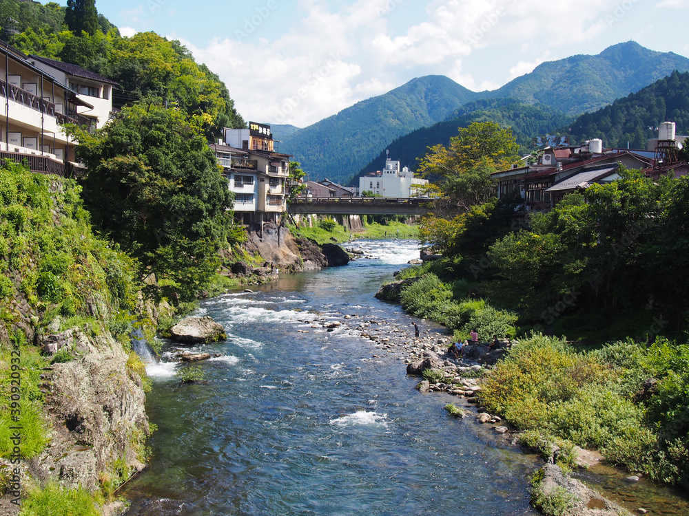 An angler entering the Yoshida River in Gujo City, Gifu Prefecture