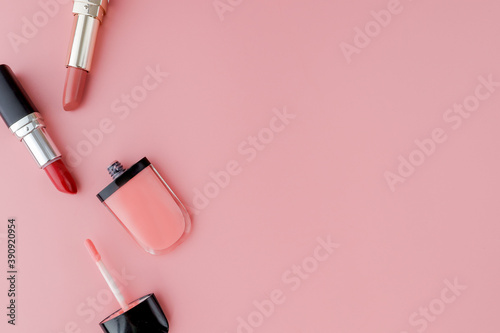 Fototapeta Naklejka Na Ścianę i Meble -  Makeup products on pink background. Top view with copy space
