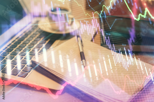 Double exposure of forex chart drawing and desktop with coffee and items on table background. Concept of financial market trading