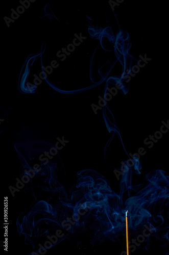 incense and smoke close-up on a black background
