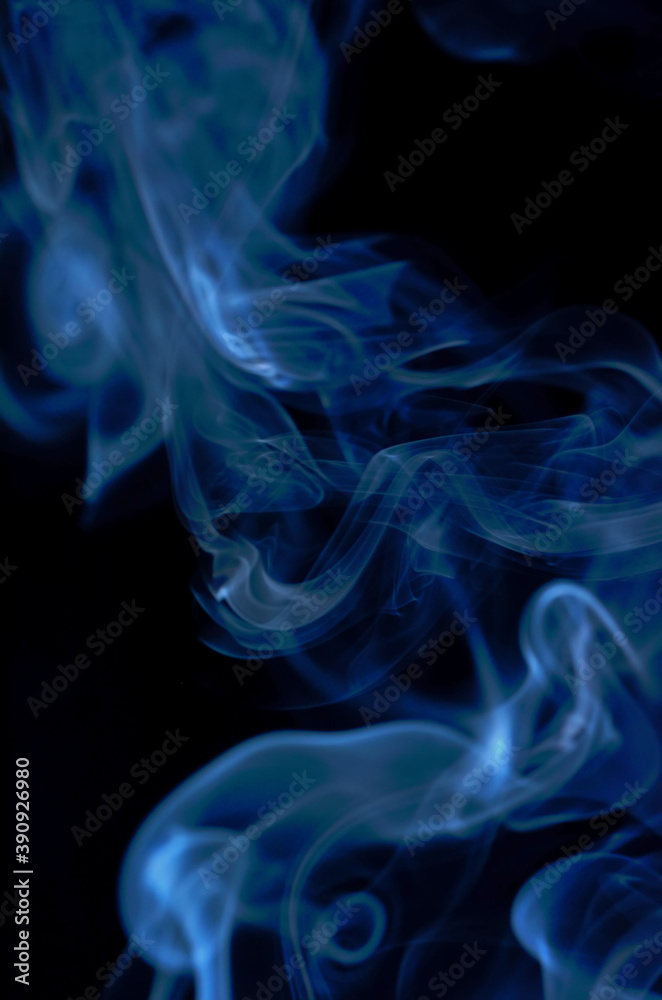 Smoke streaming on a black background close-up