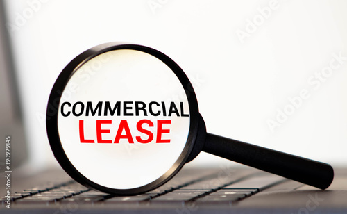 Inside the magnifier there is an inscription - COMMERCIAL LEASE