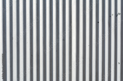 Corrugated metal exterior beaten by the weather. Abstract background.