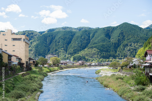 An angler entering the Yoshida River in Gujo City, Gifu Prefecture