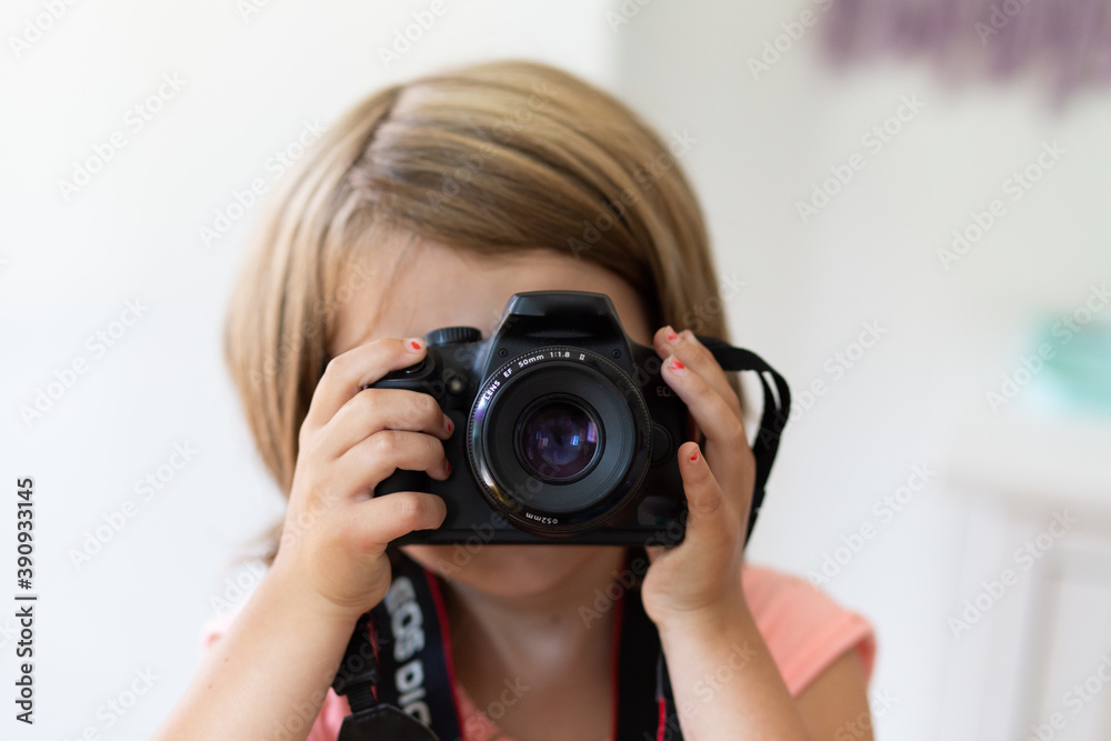 Child taking photos with camera