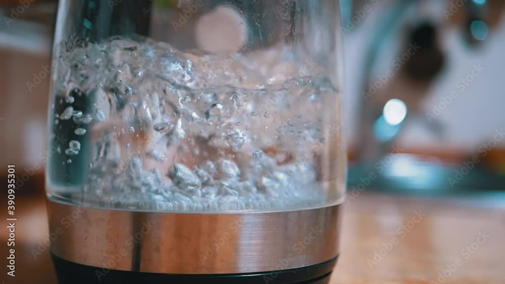 Bubbles in Water Boiling Inside Glass Electric Kettle on Backdrop ...