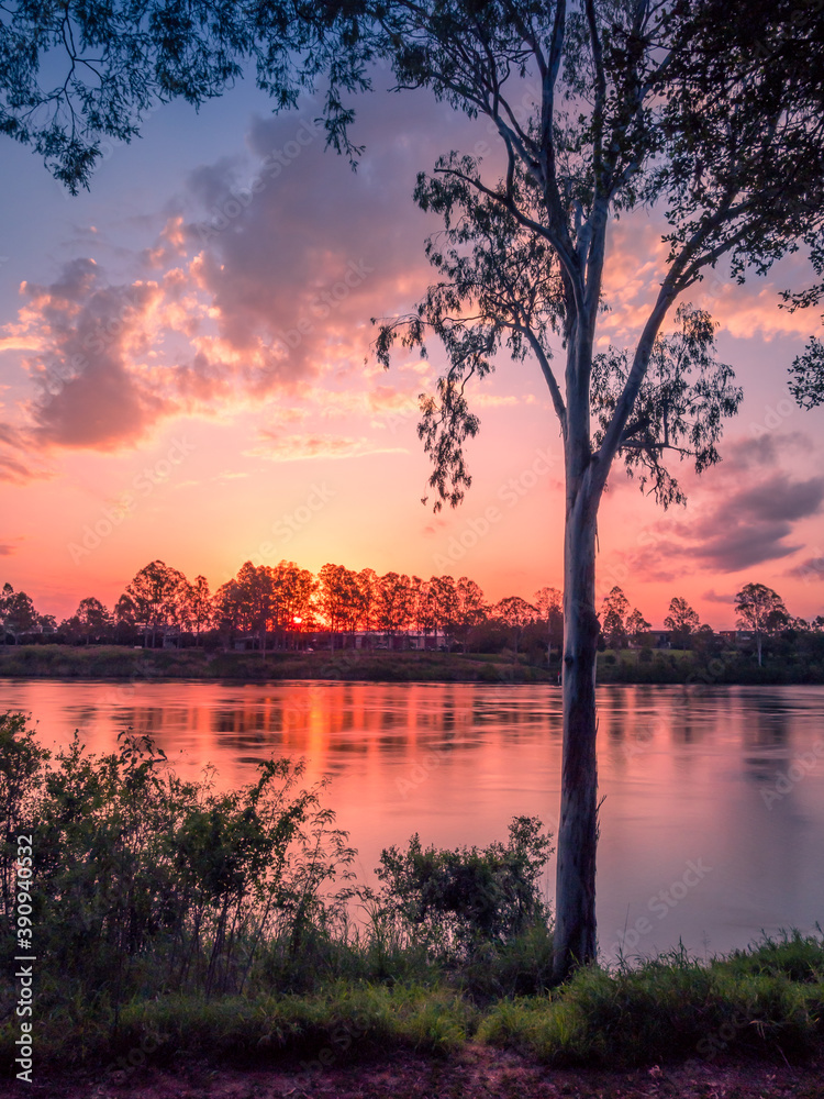 Beautiful Riverside Sunset with Reflections Portrait Mode Beautiful Riverside Sunset with Reflections Portrait Mode
