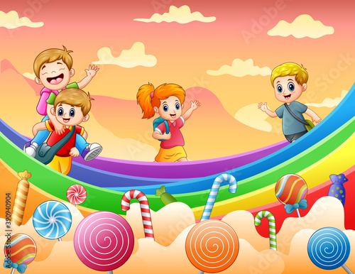 Happy kids playing on a candy land illustration