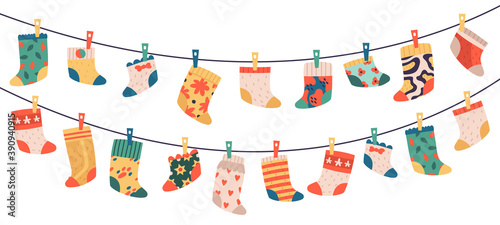 Children socks. Hanging colorful drying cotton or wool socks, cute baby clothes, socks hang on laundry rope vector illustration symbols set