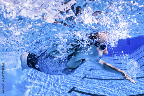 athlete diving in a swimming po photo