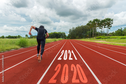 The start into the new year 2021. Start up of running on race track go to Goal of Success. Holiday sport Concept