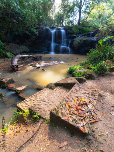 Steps into the river with Balaka falls on the background. photo