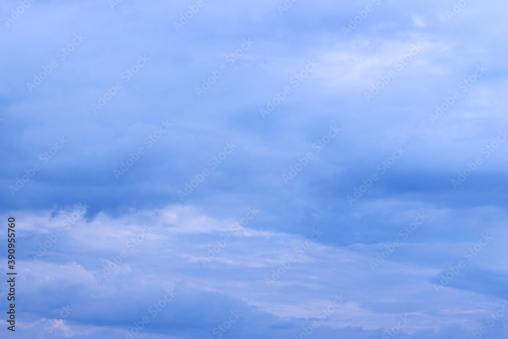 Beautiful blue sky background. Heavenly, gentle empty background. Blue and white bright atmosphere. Fantastic soft clouds.