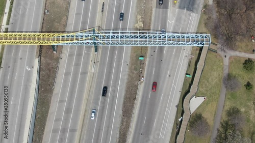 Top down view of a freeway highway with cars driving in moderate traffic, 4k drone photo