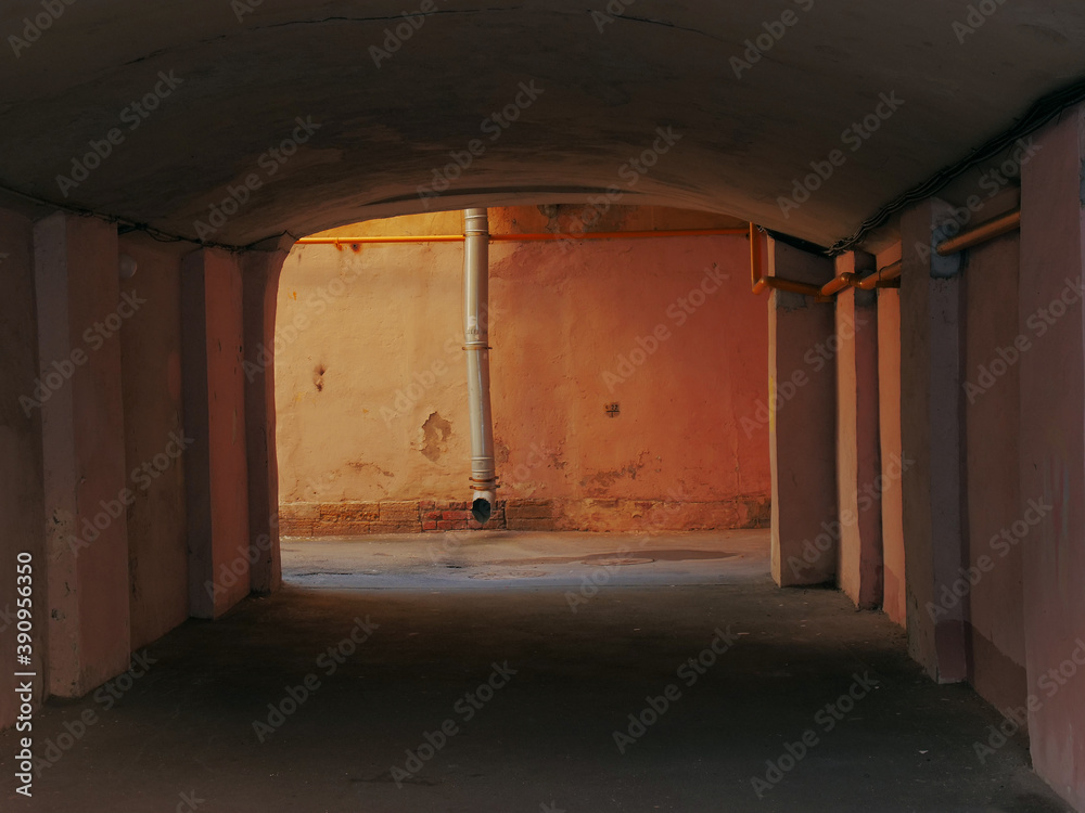 Obraz premium urban environment gutter pipe in courtyard arch
