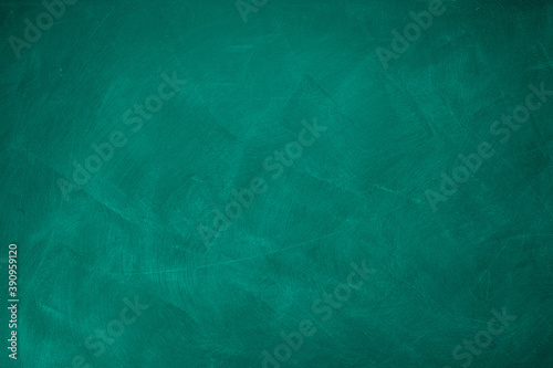 Abstract texture of chalk rubbed out on green blackboard or chalkboard background. School education, dark wall backdrop or learning concept.
