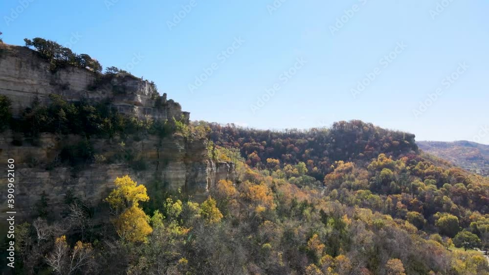 Aerial view of stunning mountain cliffs surrounded by forest. Rocky mountain cliffs of Cliffwood Bluff in La Crosse, Wisconsin Aerial view of stunning mountain cliffs surrounded by forest. Rocky mountain cliffs of Cliffwood Bluff in La Crosse, Wisconsin