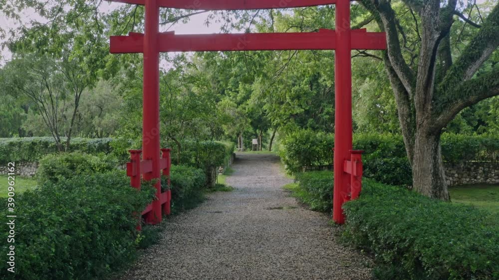 Walk toward red entrance of Japanese Garden, Santo Domingo. Slow-motion Walk toward red entrance of Japanese Garden, Santo Domingo. Slow-motion