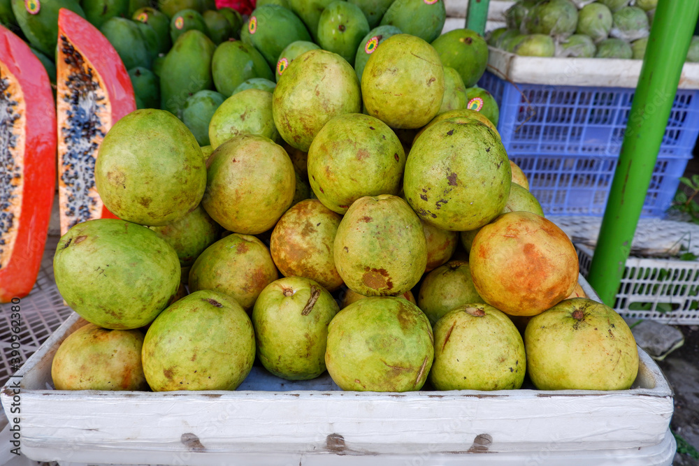 Arrangement of guava fruit in a basket at a traditional fruit shop in Yogyakarta Arrangement of guava fruit in a basket at a traditional fruit shop in Yogyakarta