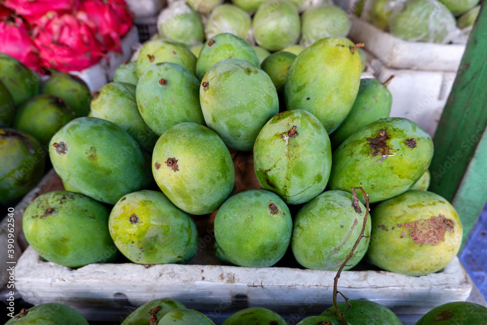 Arranged mango fruit in a basket at a traditional fruit shop in Yogyakarta Arranged mango fruit in a basket at a traditional fruit shop in Yogyakarta