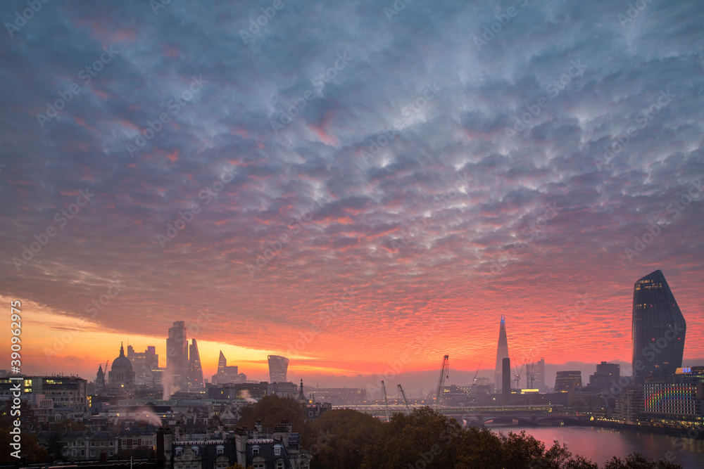 Majestic lamndscape image of sunrise over London cityscape with stunning sky formations over iconic landmarks
